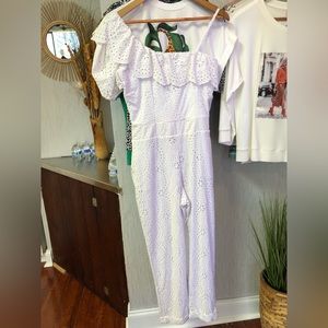 One sleeve embroidered white jumpsuit.